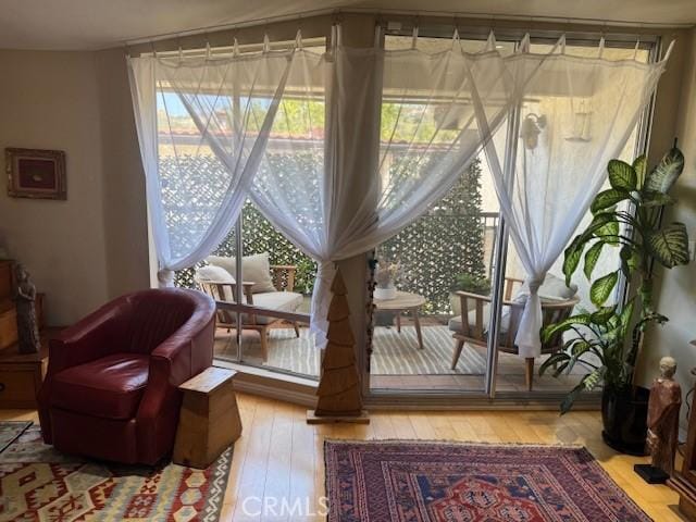 sitting room featuring hardwood / wood-style flooring