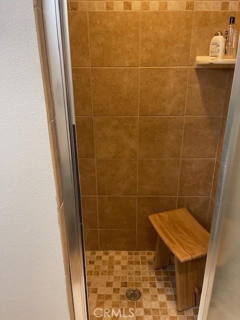 full bathroom featuring a stall shower