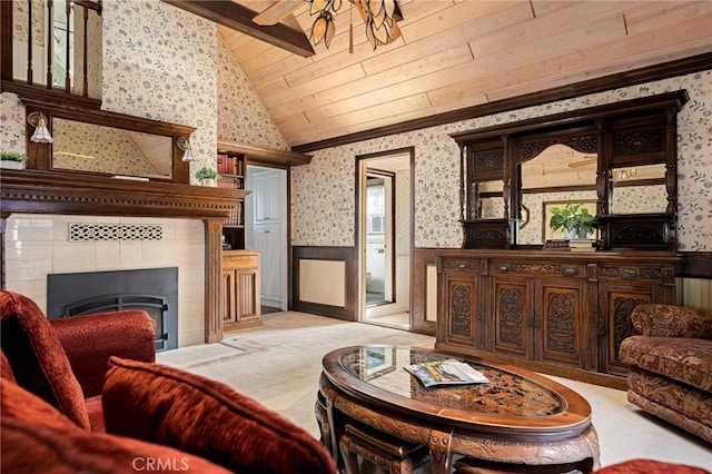 229 Maple Dr, Lake Arrowhead, CA 92352 - living area featuring wallpapered walls, a wainscoted wall, a tile fireplace, wooden ceiling, and light carpet