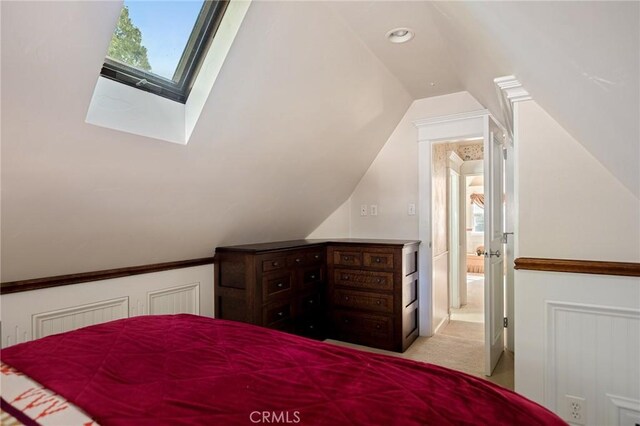 229 Maple Dr, Lake Arrowhead, CA 92352 - bedroom featuring lofted ceiling, light colored carpet, and a skylight