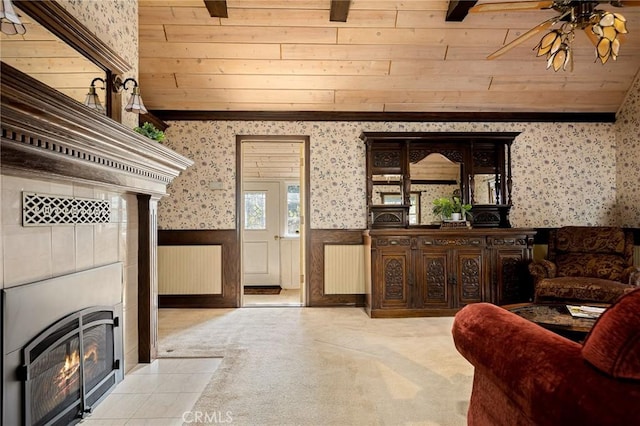 229 Maple Dr, Lake Arrowhead, CA 92352 - carpeted living area featuring wallpapered walls, wainscoting, ceiling fan, a fireplace, and wood ceiling