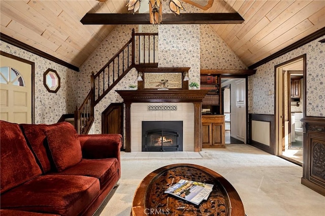 229 Maple Dr, Lake Arrowhead, CA 92352 - carpeted living room featuring wallpapered walls, crown molding, a wainscoted wall, stairs, and wood ceiling