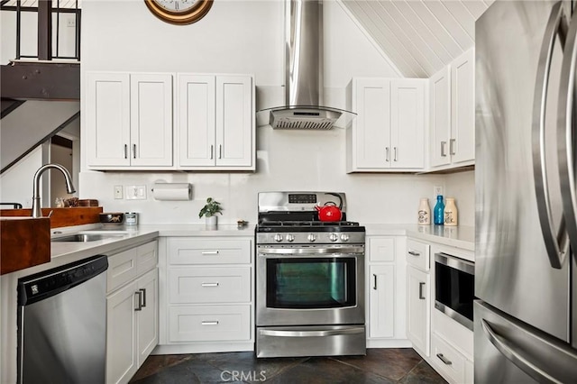 28919 Palisades Dr, Lake Arrowhead, CA 92352 - kitchen featuring appliances with stainless steel finishes, light countertops, wall chimney exhaust hood, lofted ceiling, and a sink