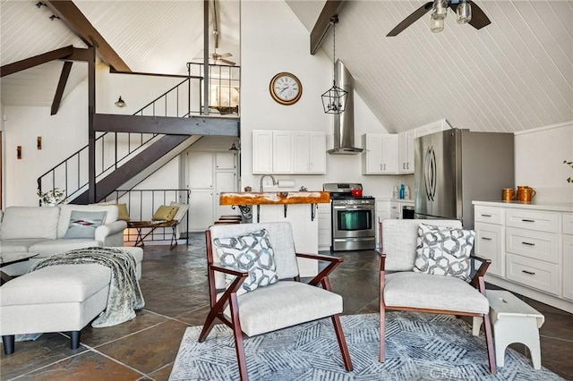 28919 Palisades Dr, Lake Arrowhead, CA 92352 - living room with stairs, beam ceiling, and ceiling fan