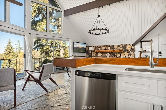 28919 Palisades Dr, Lake Arrowhead, CA 92352 - kitchen with beamed ceiling, stainless steel dishwasher, white cabinetry, light countertops, and a sink