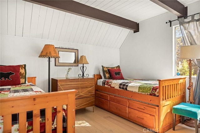 28919 Palisades Dr, Lake Arrowhead, CA 92352 - bedroom with light wood-style flooring and lofted ceiling with beams