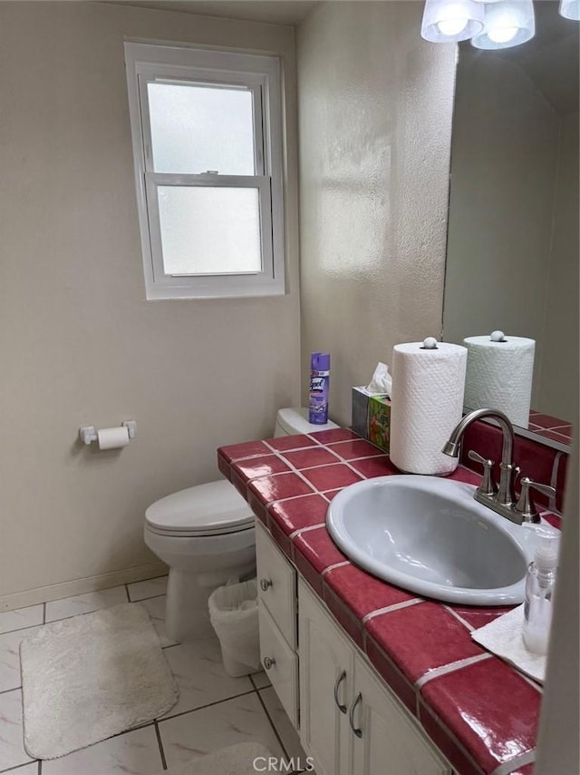 344 Ultimo Ave, Long Beach, CA 90814 - half bath featuring vanity, marble finish floor, baseboards, and toilet