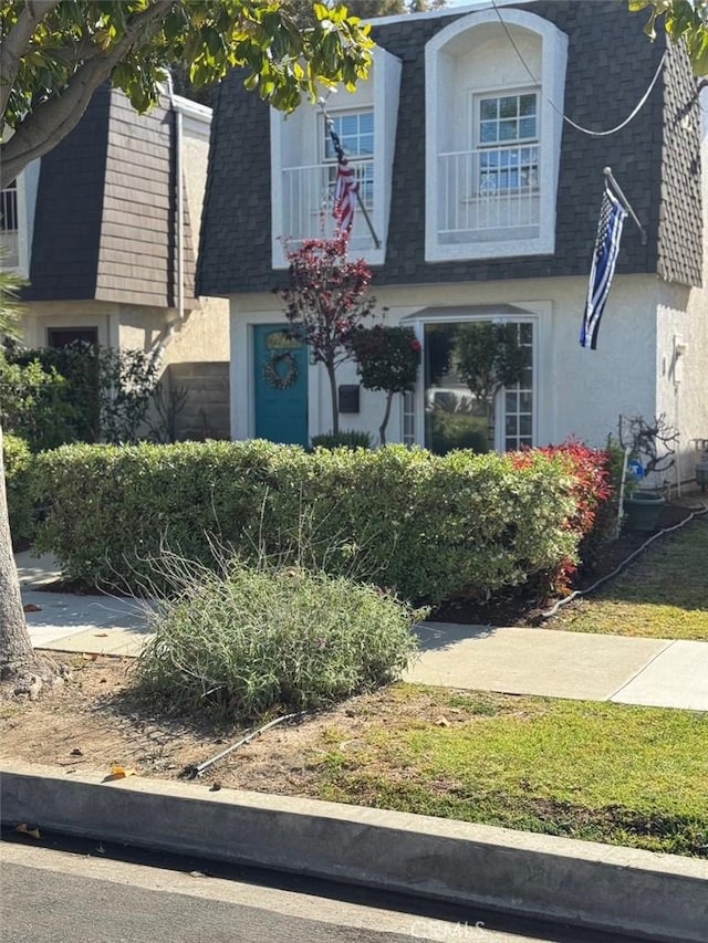 344 Ultimo Ave, Long Beach, CA 90814 - view of front of home with roof with shingles, mansard roof, and stucco siding
