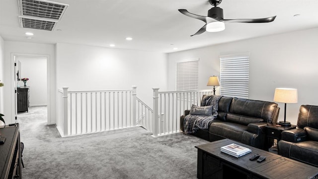 living room with visible vents, recessed lighting, carpet flooring, and a ceiling fan