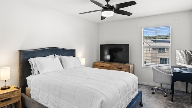 carpeted bedroom featuring a ceiling fan and baseboards