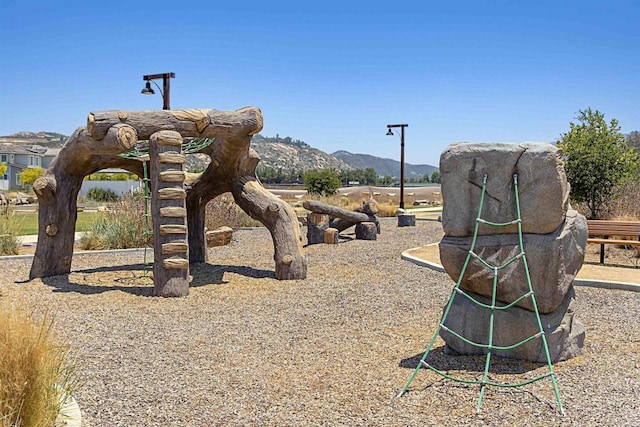 surrounding community with a mountain view