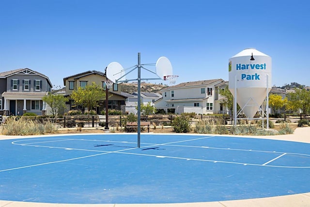 exterior space with a residential view and community basketball court