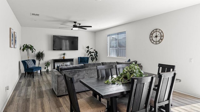 dining area featuring ceiling fan, baseboards, wood finished floors, and visible vents