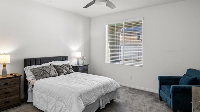 bedroom featuring baseboards, a ceiling fan, and carpet