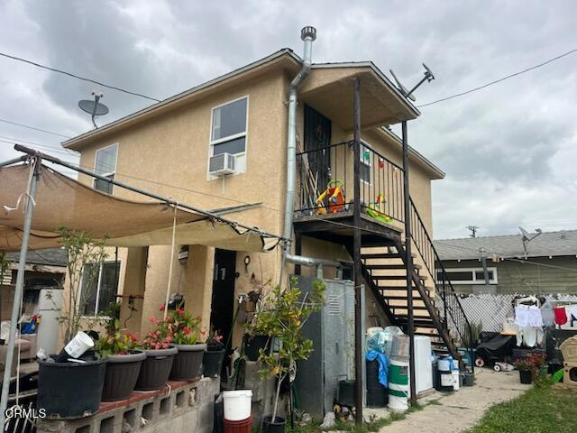 321 Walnut St, Santa Paula, CA 93060 - back of property featuring stairway and stucco siding