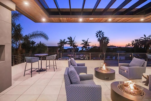5170 Carlsbad Blvd, Carlsbad, CA 92008 - patio terrace at dusk with a fire pit and a patio area