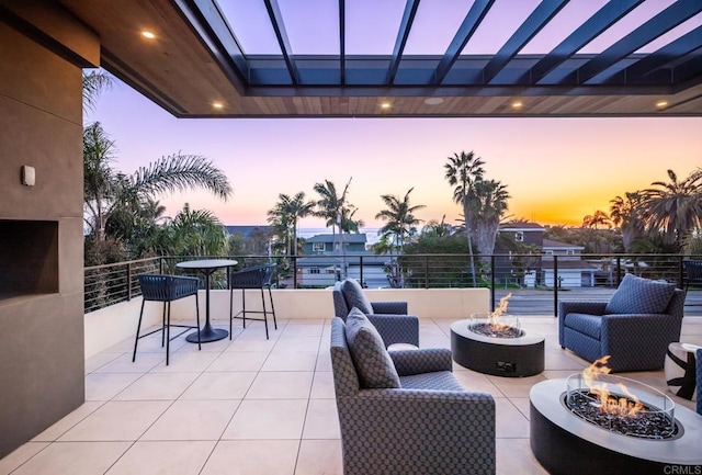 5170 Carlsbad Blvd, Carlsbad, CA 92008 - patio terrace at dusk featuring an outdoor fire pit and a patio