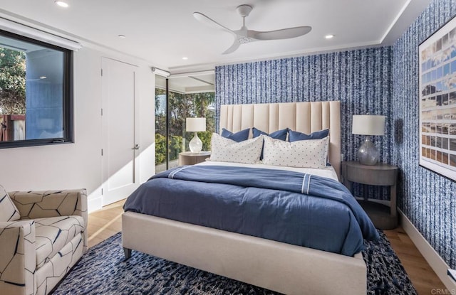 5170 Carlsbad Blvd, Carlsbad, CA 92008 - bedroom featuring wallpapered walls, wood finished floors, a ceiling fan, crown molding, and recessed lighting