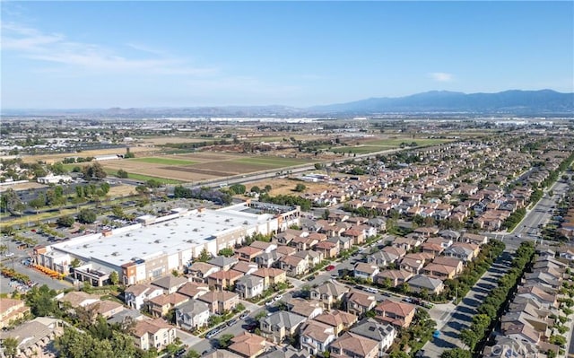 drone / aerial view featuring a mountain view and a residential view