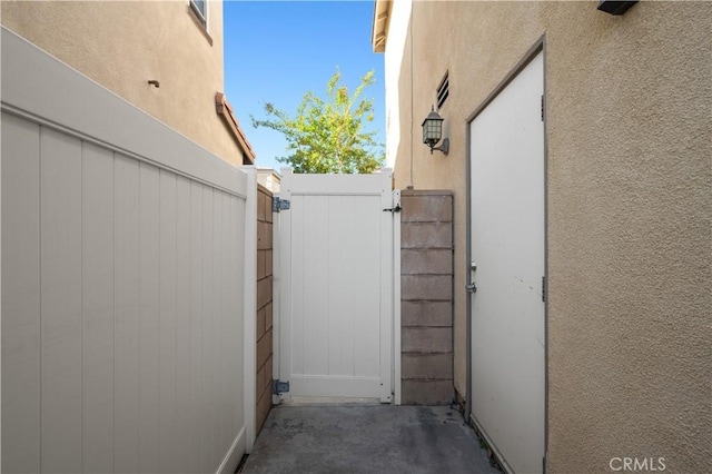 view of patio with a gate
