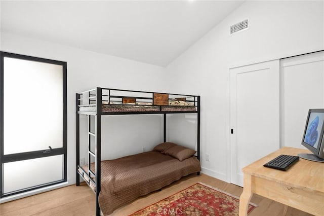 990 Meadowlark Dr, Laguna Beach, CA 92651 - bedroom featuring visible vents, vaulted ceiling, and wood finished floors