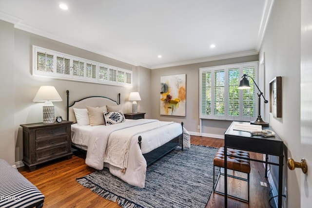 bedroom with recessed lighting, baseboards, ornamental molding, and wood finished floors