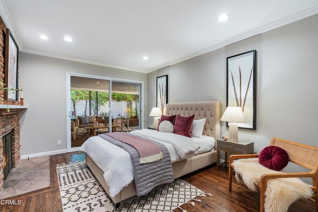 bedroom featuring access to outside, baseboards, a fireplace, crown molding, and wood finished floors