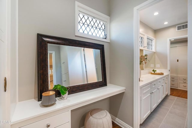 bathroom with visible vents, recessed lighting, and vanity