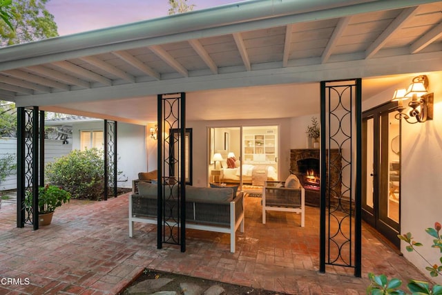 view of patio / terrace featuring an outdoor living space with a fireplace