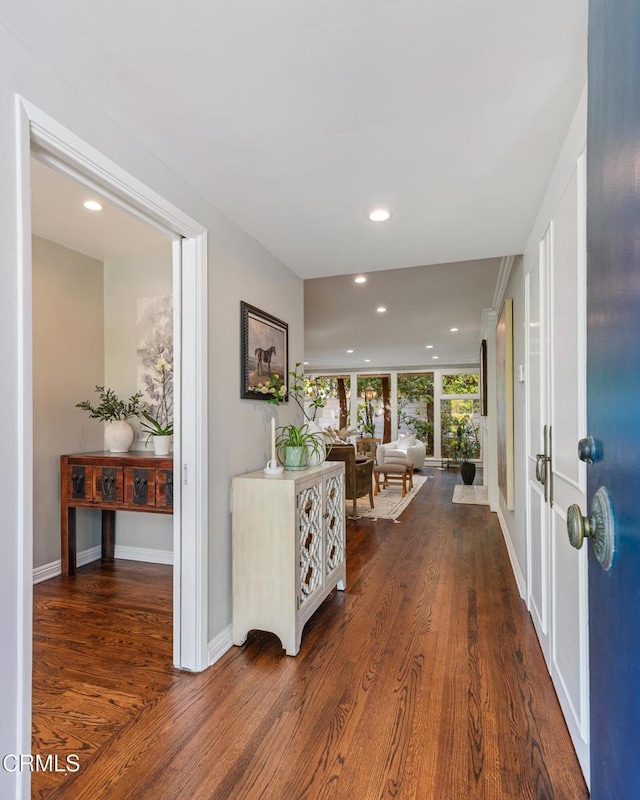 entrance foyer with dark wood-type flooring, baseboards, and recessed lighting