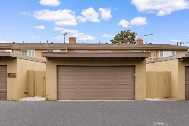 garage with fence