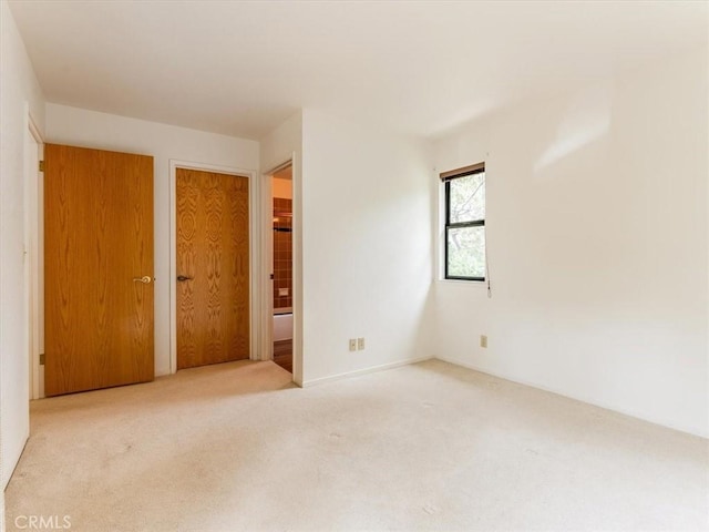 unfurnished room featuring carpet flooring