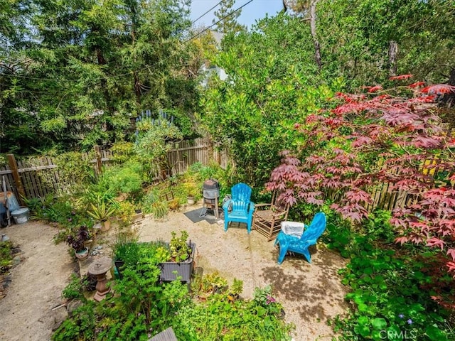 view of yard featuring fence and a patio