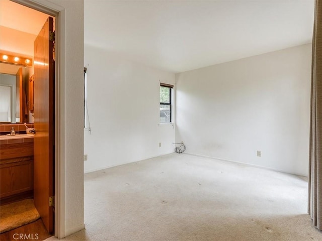 2320 Wilcombe Dr, Cambria, CA 93428 - empty room featuring light carpet and a sink