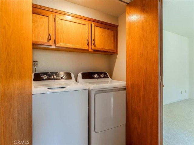 2320 Wilcombe Dr, Cambria, CA 93428 - laundry area featuring washing machine and dryer, cabinet space, and carpet