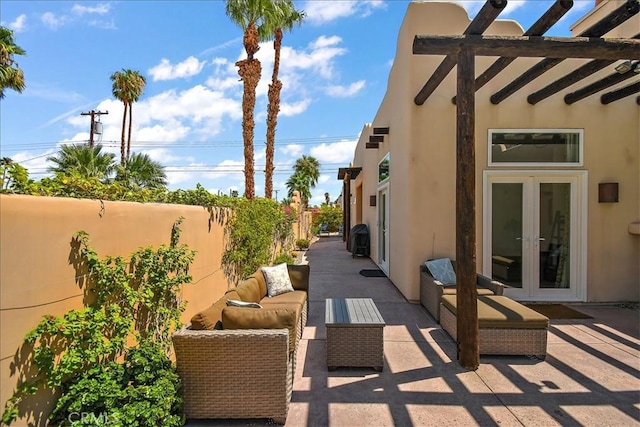 51770 Avenida Madero Ln, Quinta, CA 92253 - view of patio / terrace with french doors, a fenced backyard, and outdoor lounge area