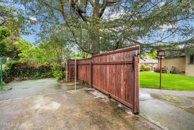 view of patio / terrace with fence and a gate