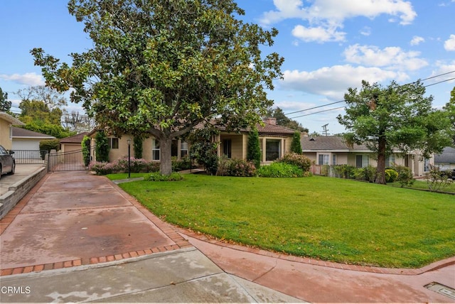 view of front of house with a front lawn and fence