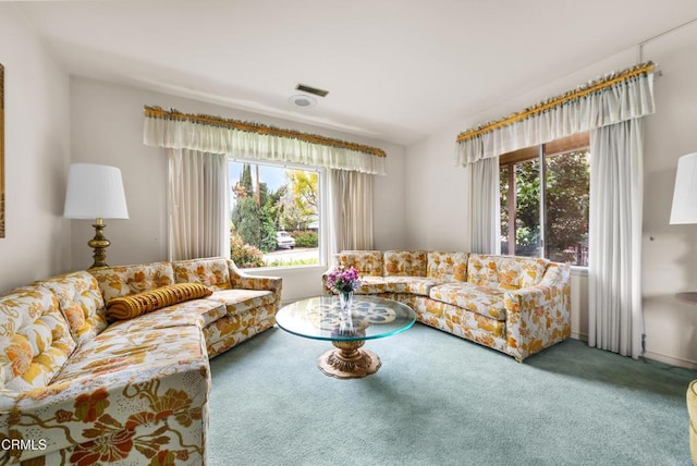 carpeted living area with visible vents