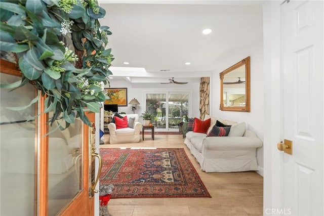 living area with ceiling fan and recessed lighting