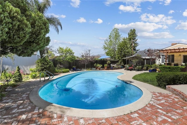 view of pool featuring a patio, a fenced backyard, and a fenced in pool