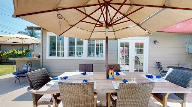 view of patio / terrace featuring outdoor dining space and french doors