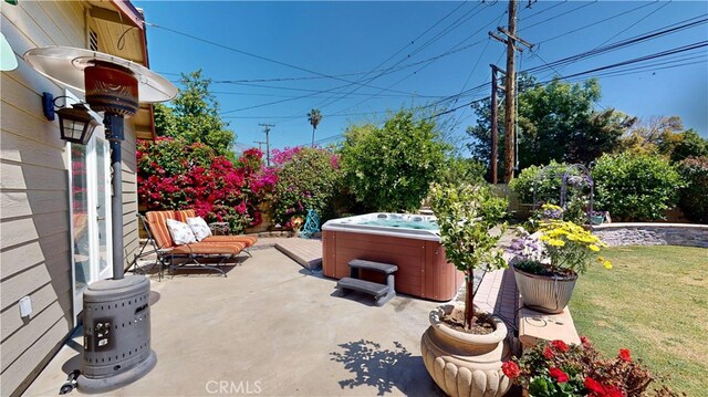 view of patio with a hot tub