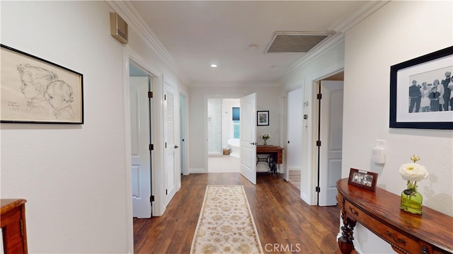 hallway with baseboards, ornamental molding, recessed lighting, visible vents, and wood finished floors