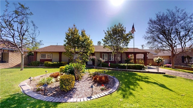 view of front of house with a front yard and stucco siding