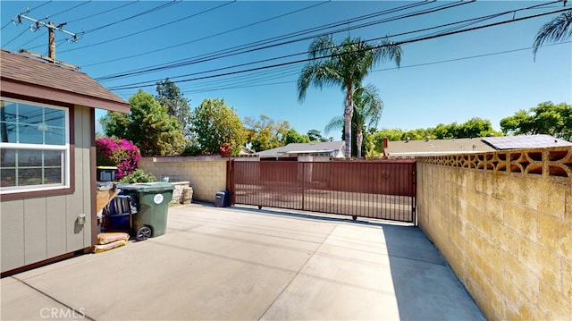view of patio featuring fence private yard and a gate