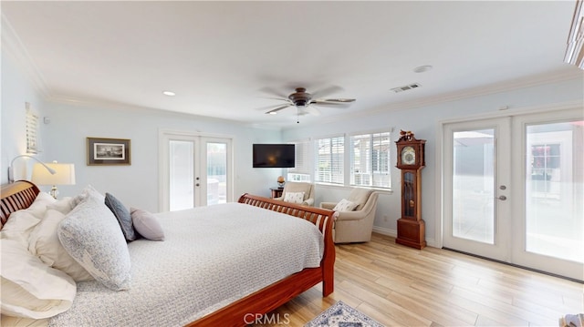 bedroom featuring access to exterior, french doors, ornamental molding, and visible vents