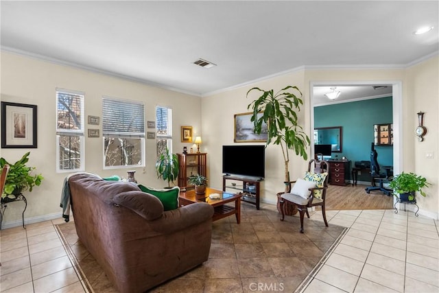 living room featuring ornamental molding, visible vents, baseboards, and tile patterned flooring