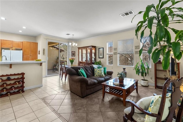 living room featuring visible vents, baseboards, light tile patterned floors, a notable chandelier, and recessed lighting