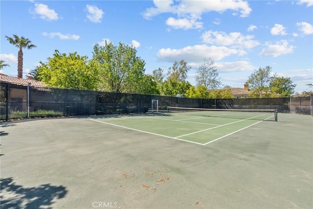 view of sport court with fence